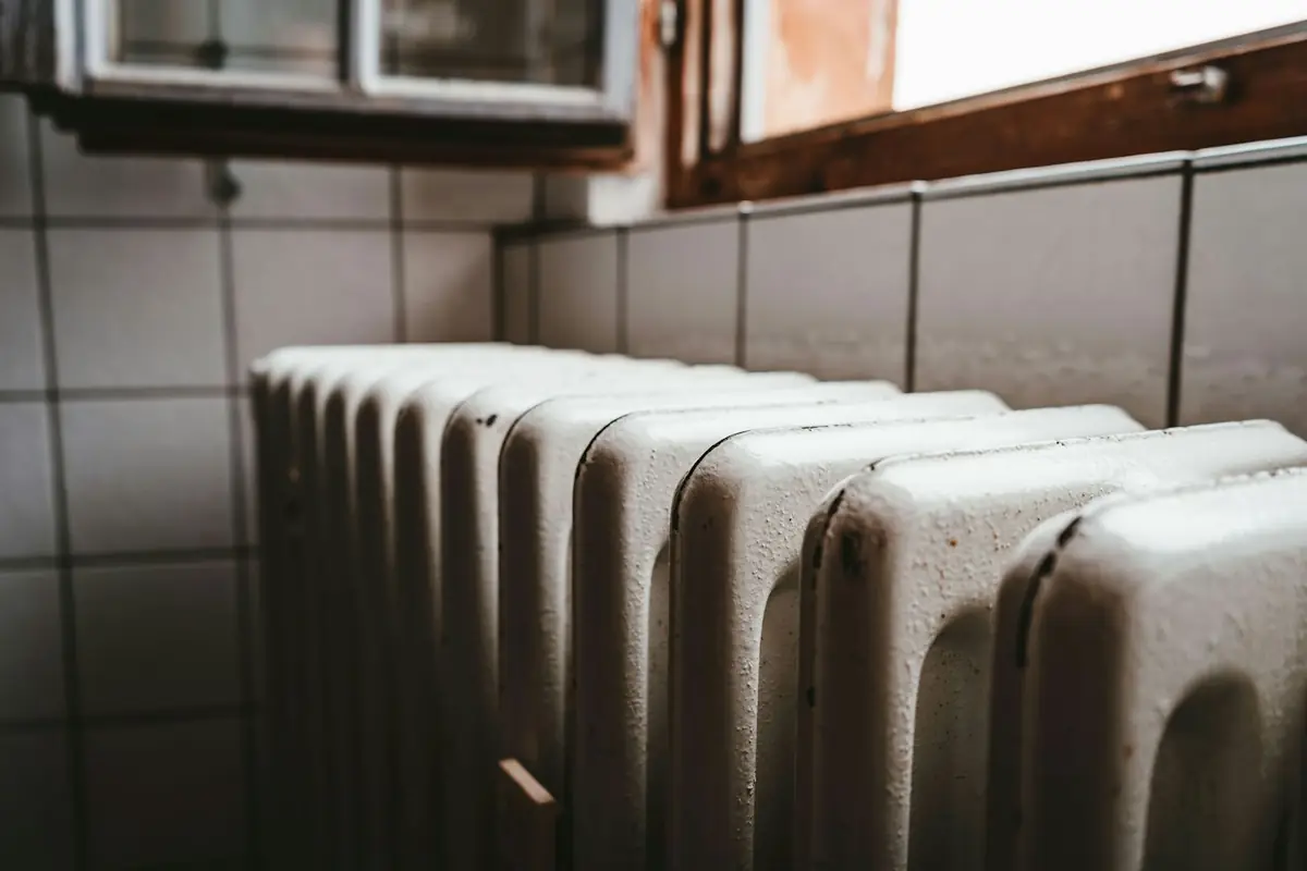 White cast iron radiator under a window