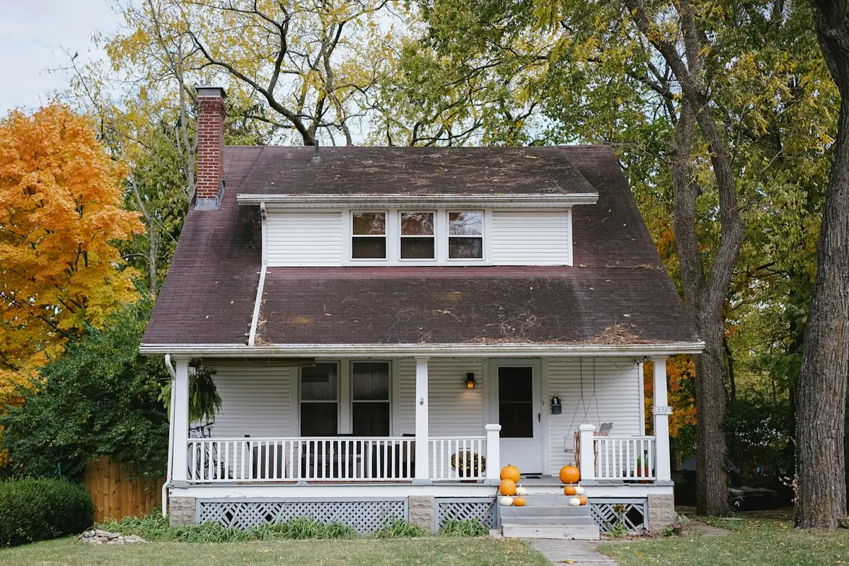 Older 2-story house with a covered front porch